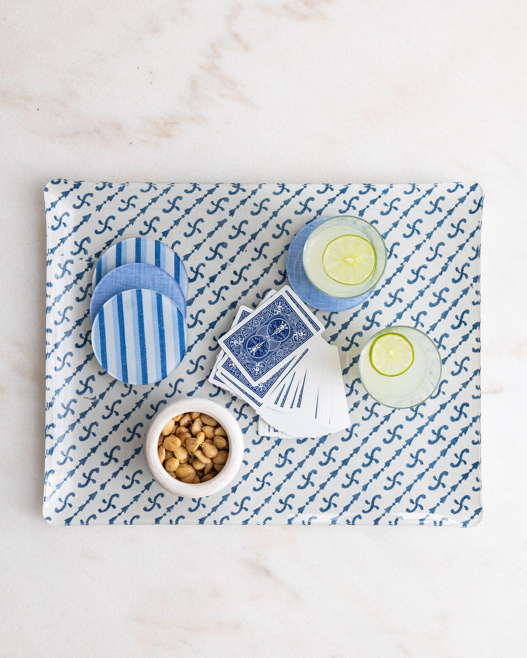 Acrylic Brooks tray with Campbell Blue Chambray coasters and mediterrean snacks.