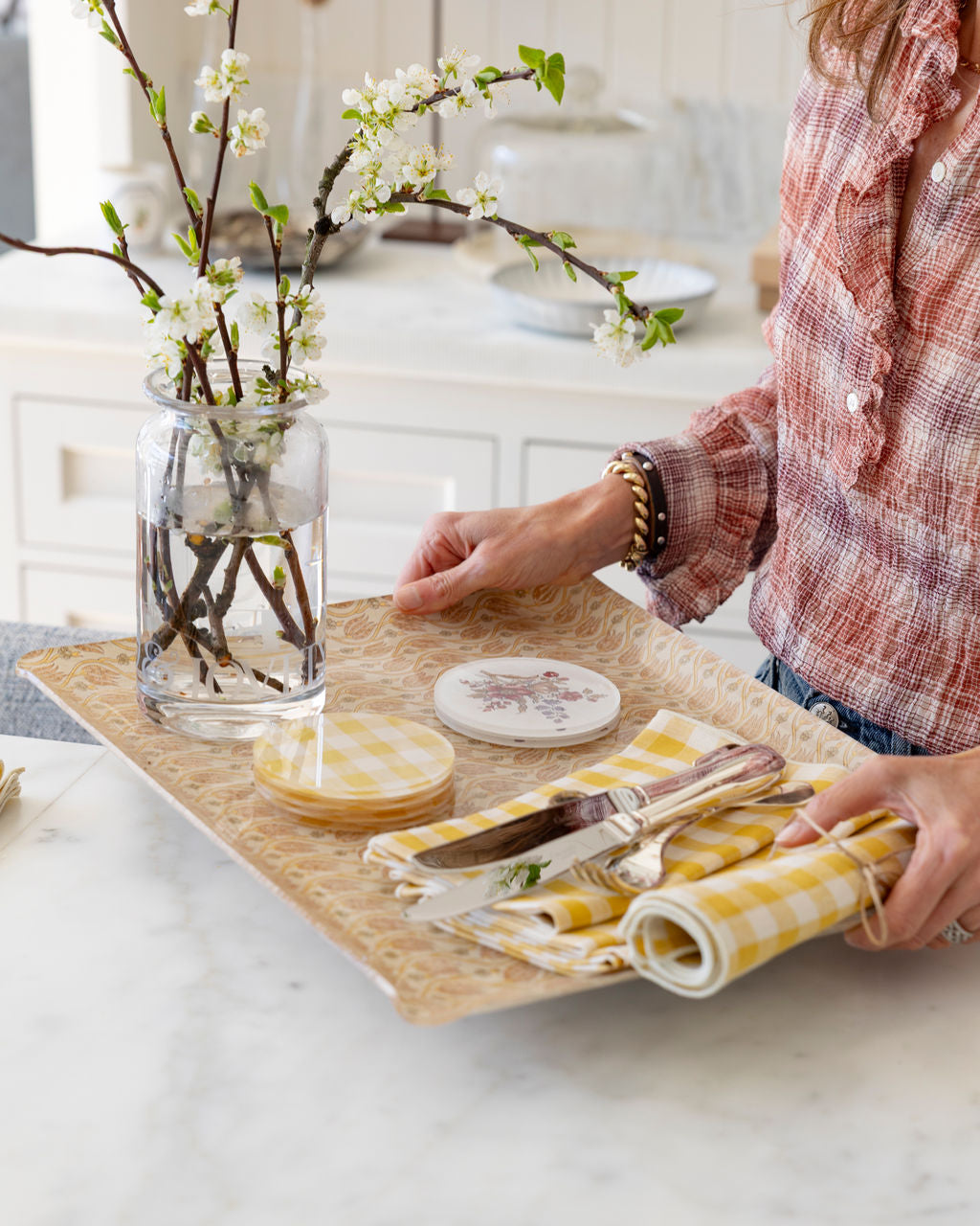 
                  
                    Proper Table Chandler tray in Petal carried with gingham coasters, a floral coaster and yellow gingham napkins
                  
                
