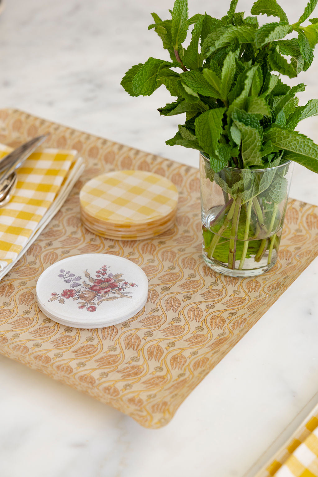 
                  
                    Chandler tray in Petal with yellow gingham coasters and a floral coaster, a tray and coaster gift set for entertaining
                  
                