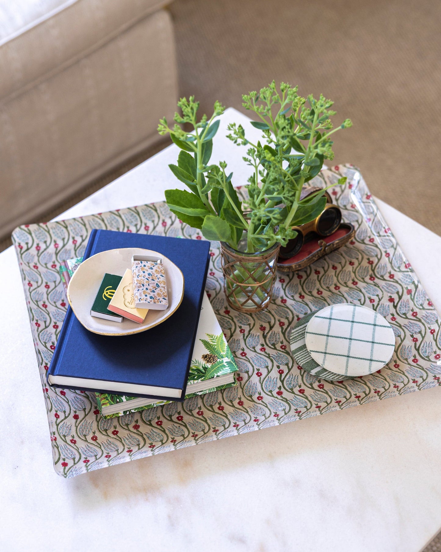 
                  
                    Proper Table Adelaide tray in beige, green, pink and blue styled for the coffee table. Adelaide decorative tray with books, a plant, and a small dish on a coffee table.
                  
                