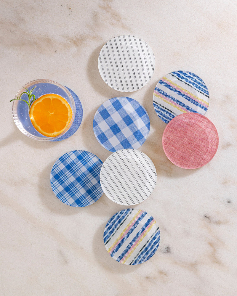 Set of colorful round coasters on a marble surface