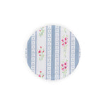 Linen-printed circular acrylic coaster in vintage gray and floral stripe fabric.