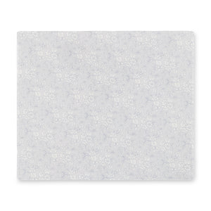 
                  
                    Rectangular linen-printed acrylic placemat with Liberty of London gray floral fabric.
                  
                